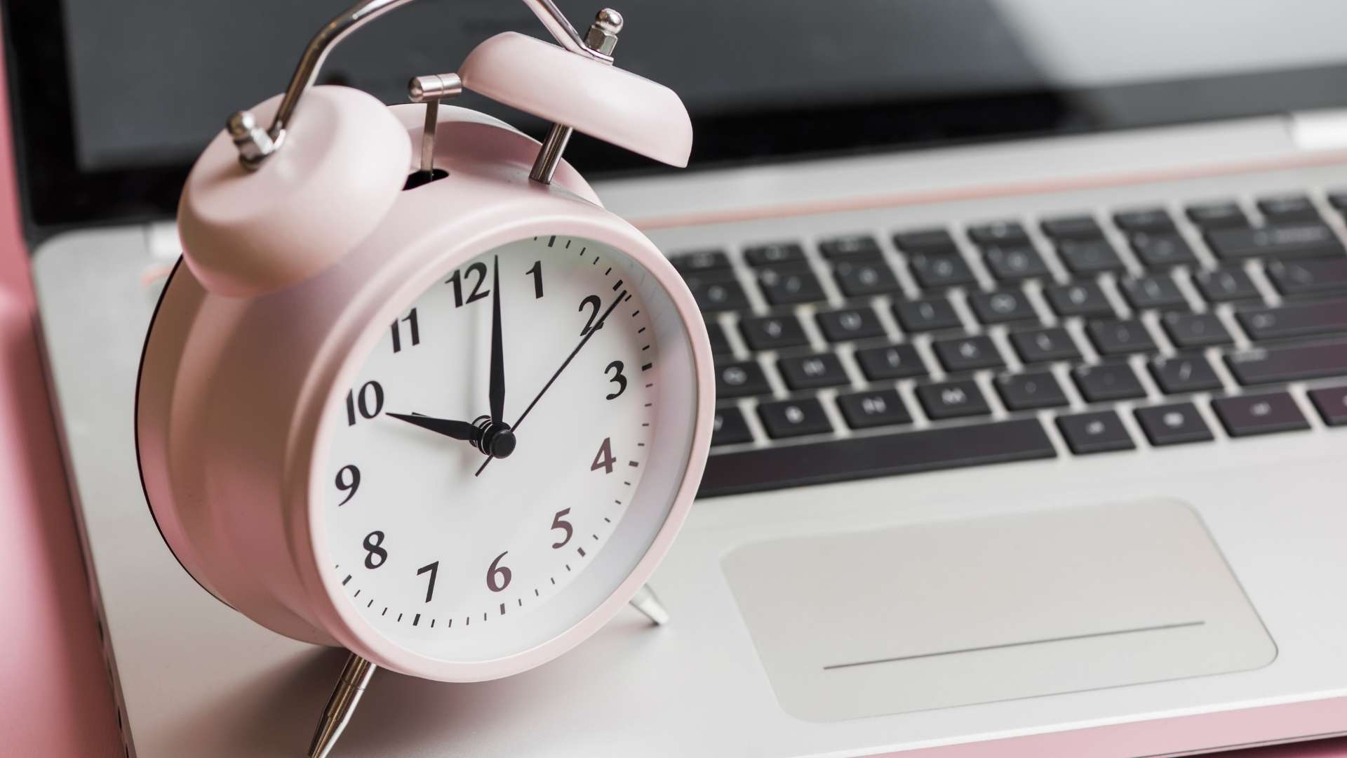 a clock and a laptop