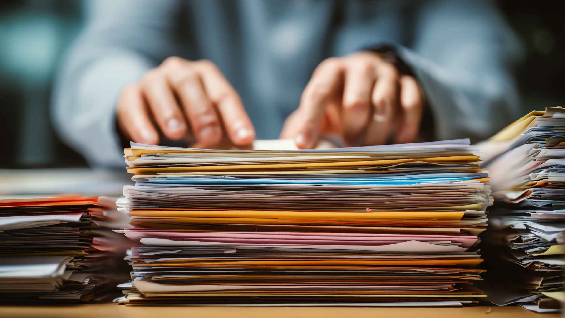 a person auditing a bunch of files