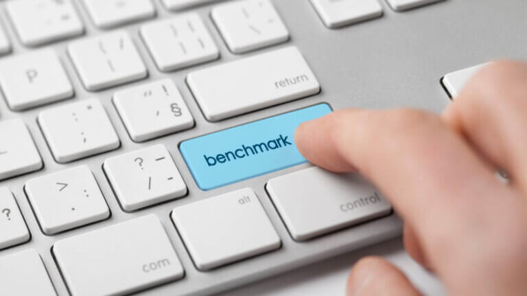 A person pressing Benchmark in keyboard