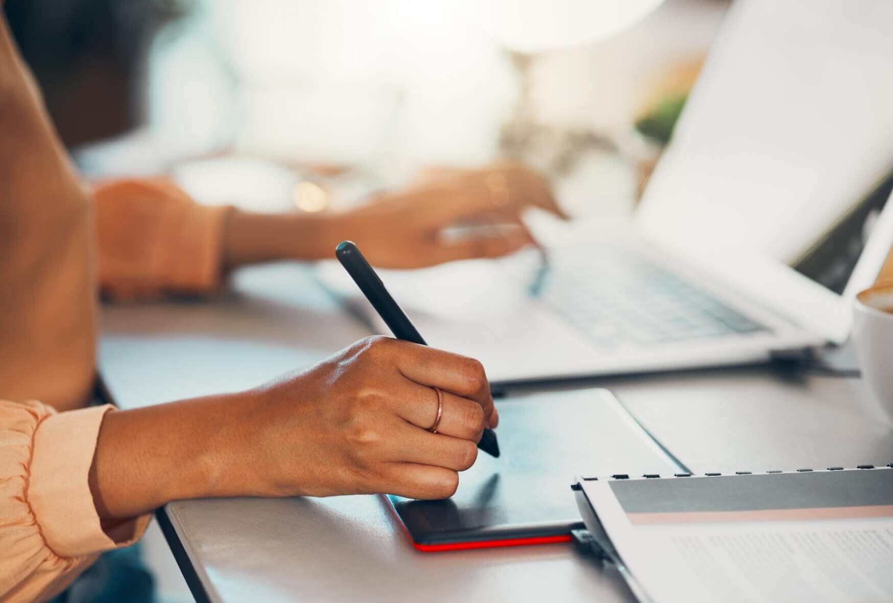 A woman sketching on the sketchpad