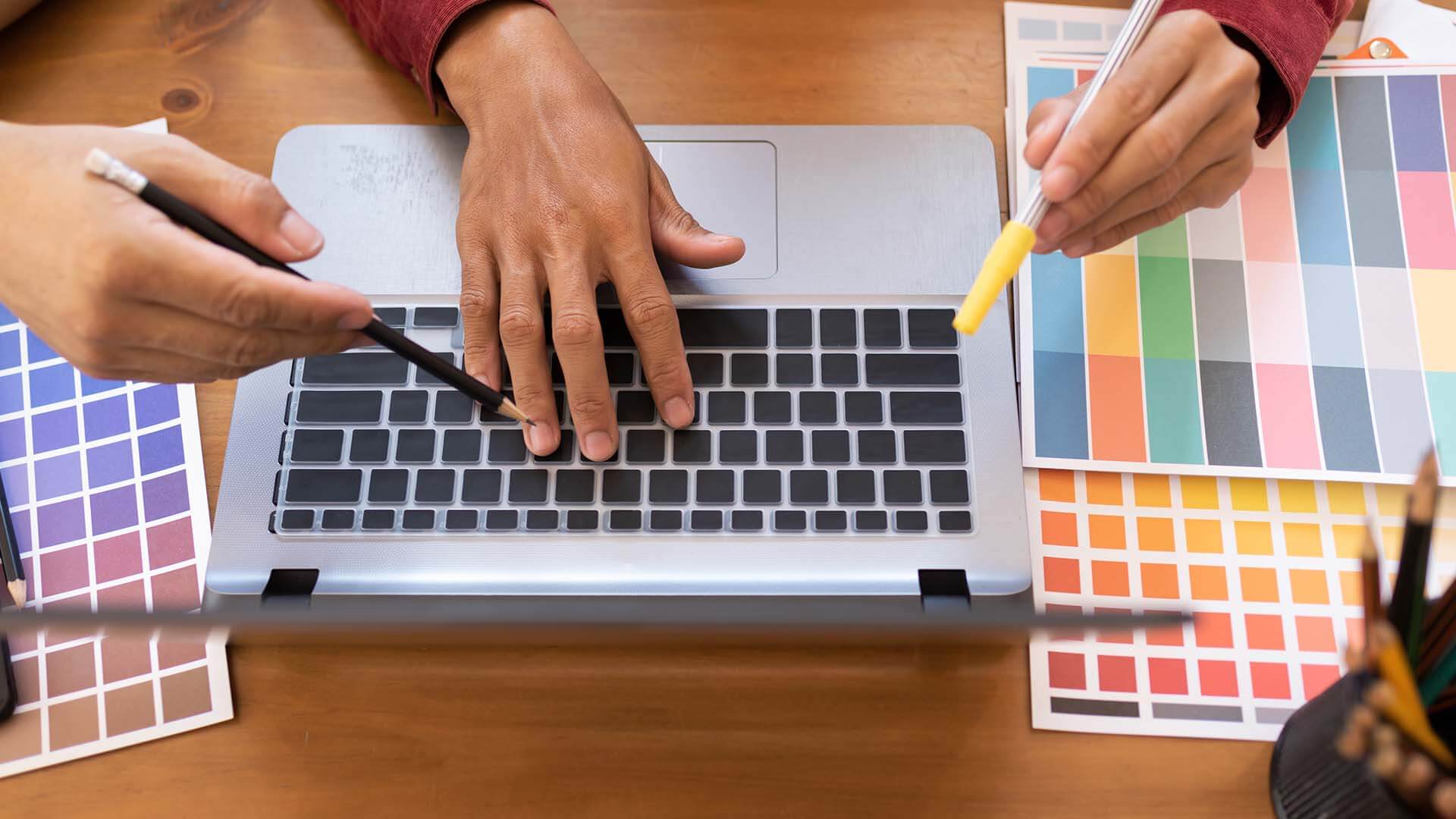 asian-colleagues-designer-drawing-sketches