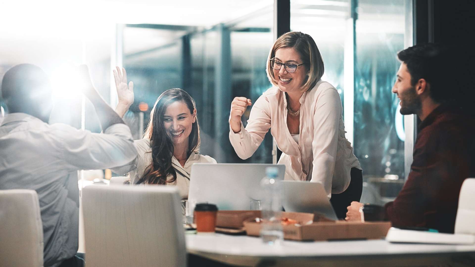 Business people are happy and celebrating for success in the office