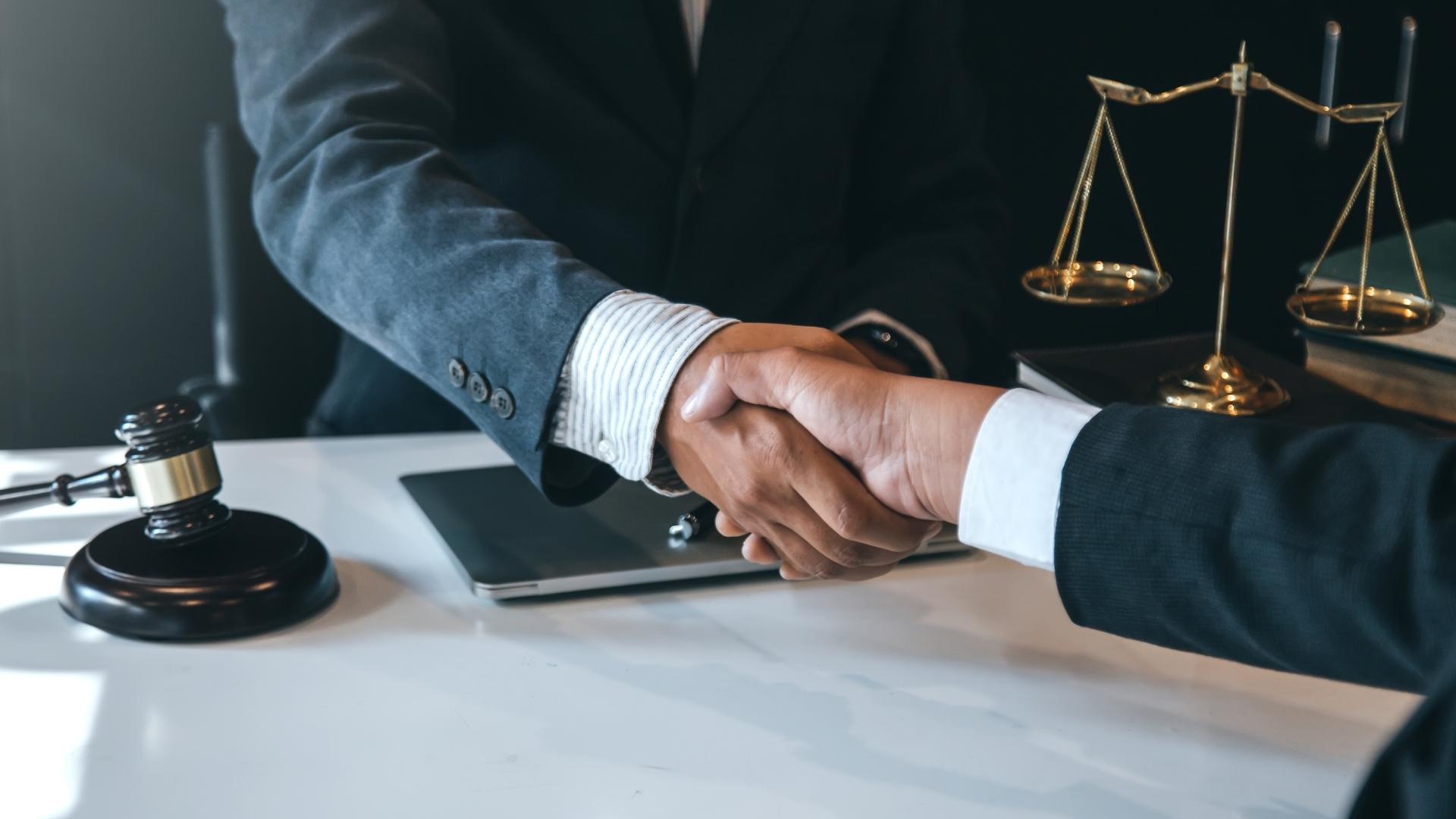 Businessman shaking hands to seal a deal with his partner