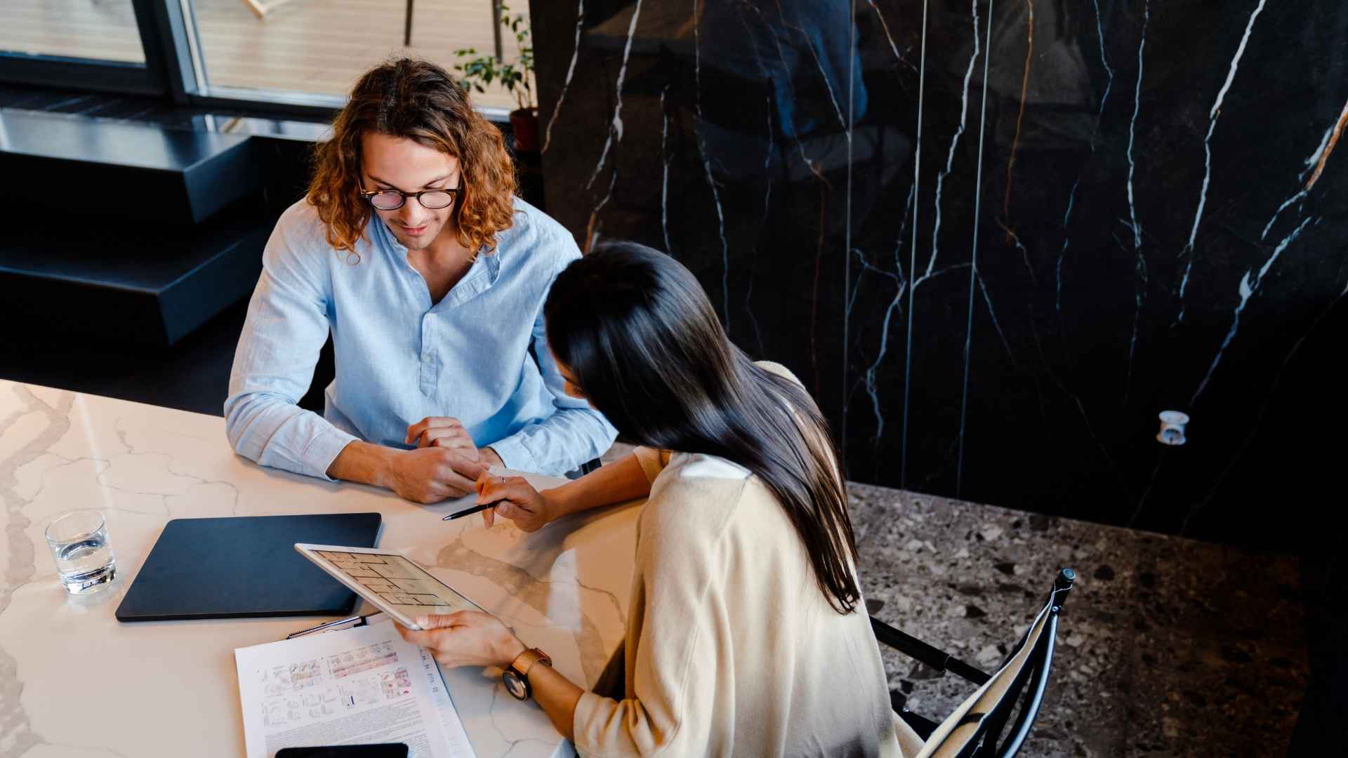 colleagues taking notes for their upcoming meeting