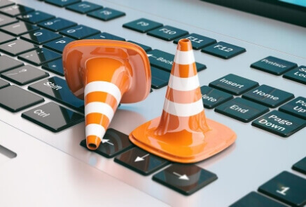 Conehead above the laptop