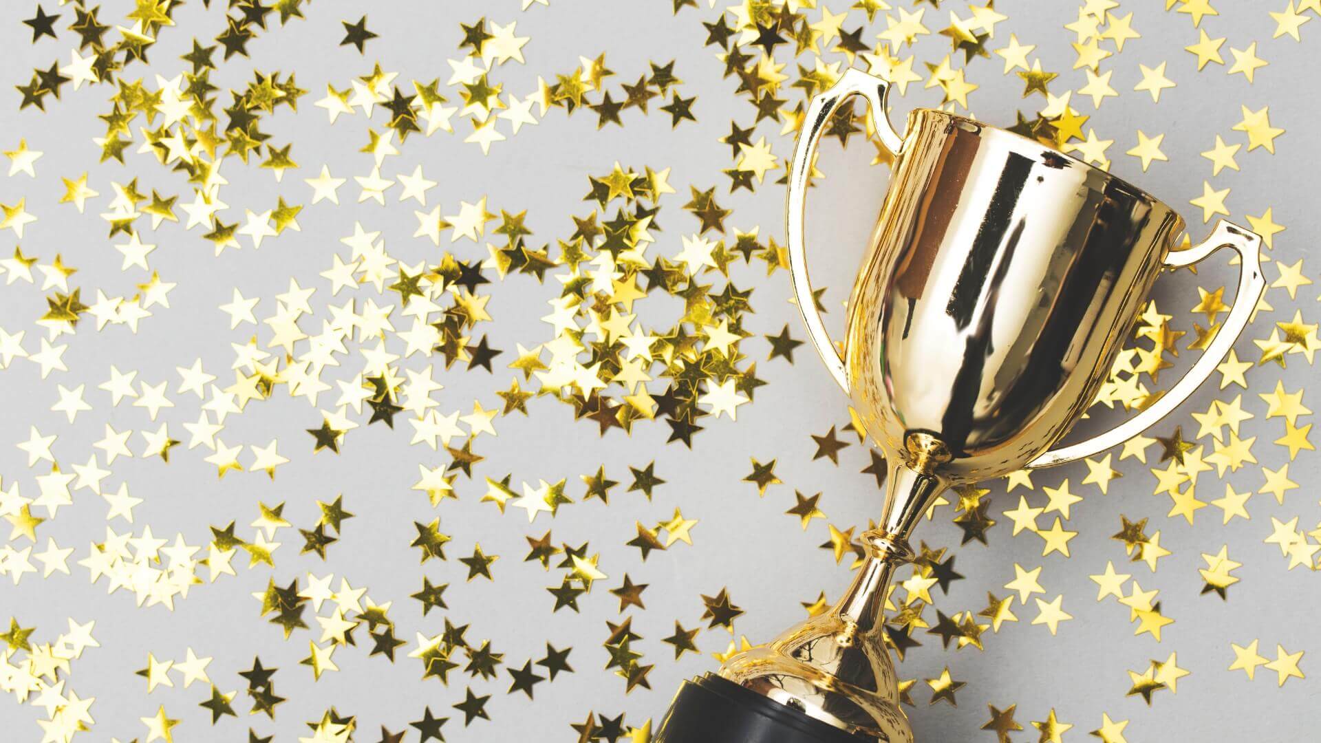 gold trophy with shining stars