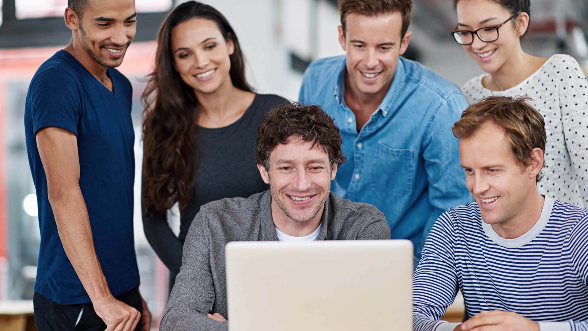group-of-colleagues-using-a-laptop