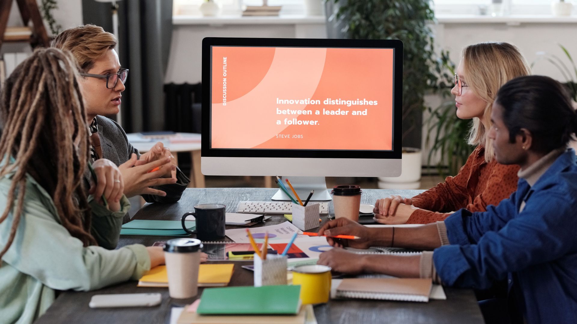 group of people looking at the powepoint slide