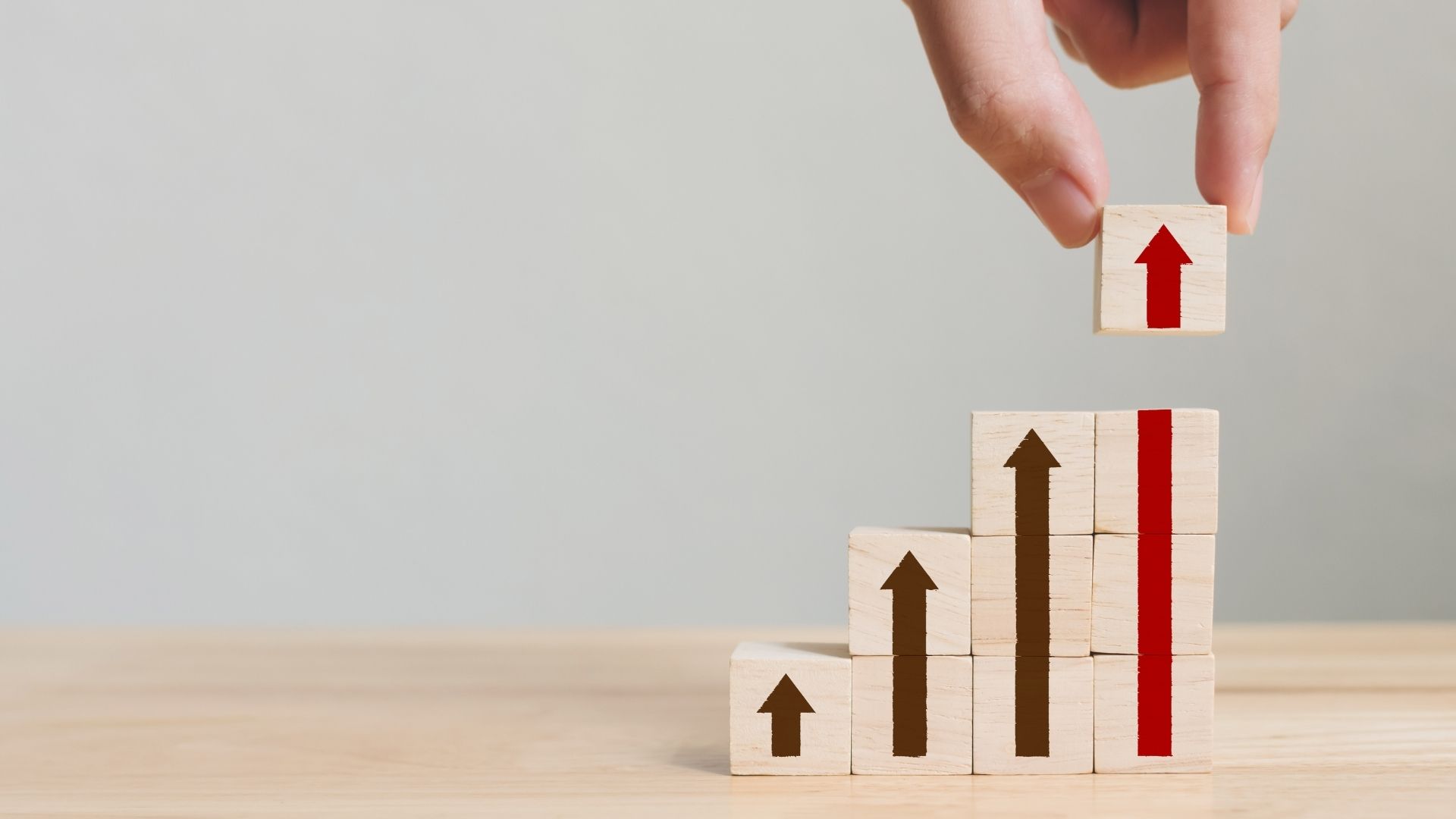 hand arranging wood block stacking
