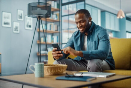 Person smiling while using phone
