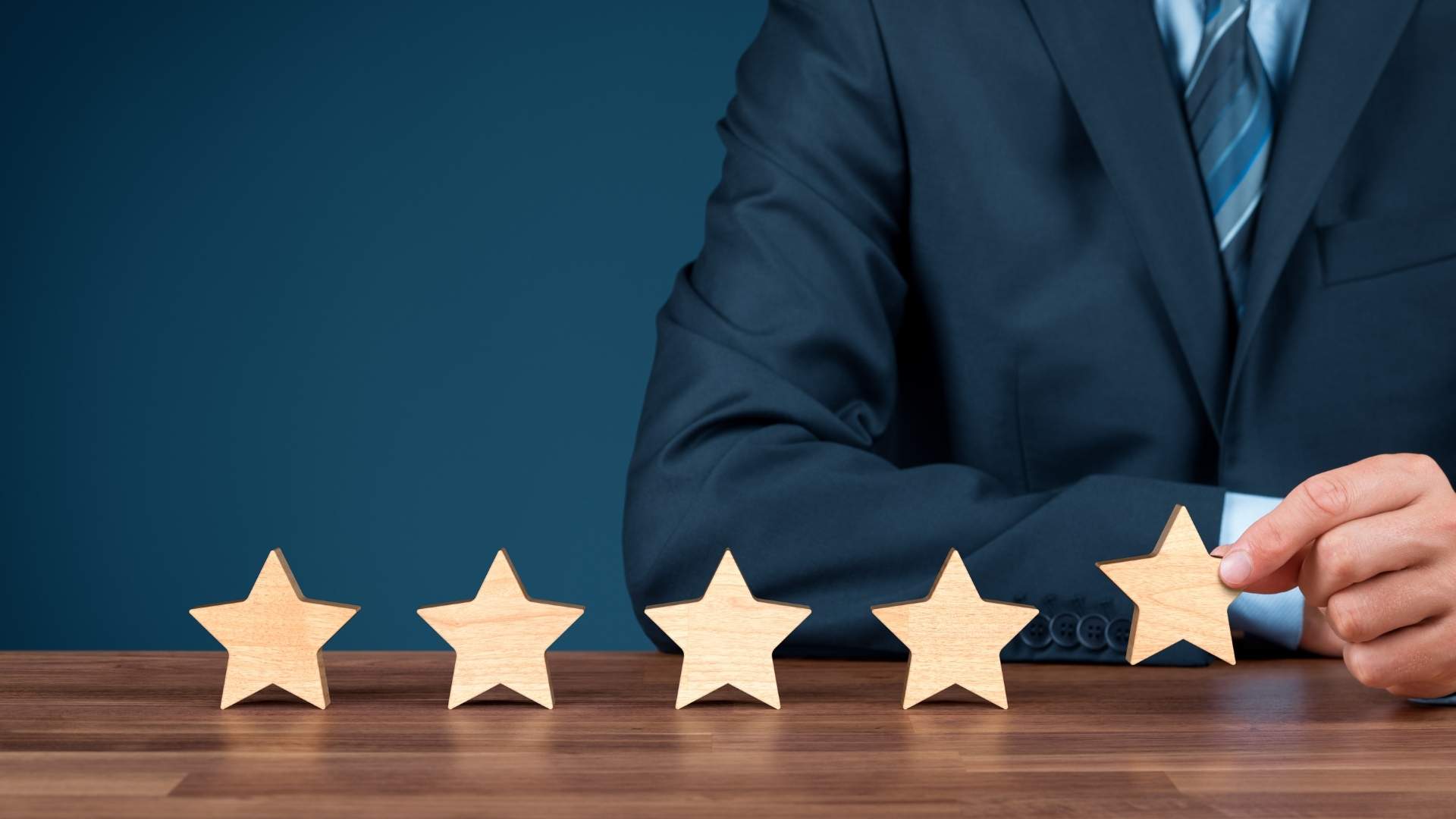 professional holding a wooden star