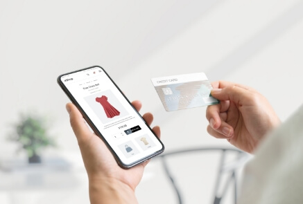 Woman purchasing in ecommerce shop using credit card