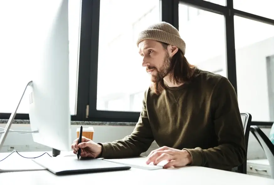 A man on the front of the computer