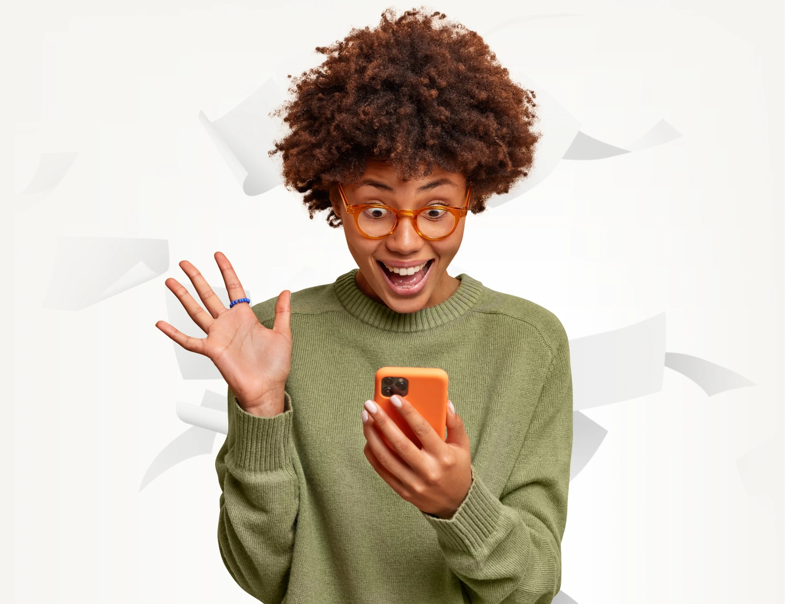 A woman is shocked after seeing something on her phone