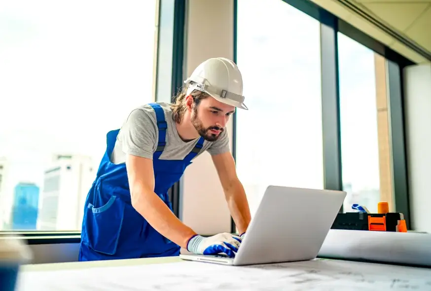 Engineer creating a plan on the laptop
