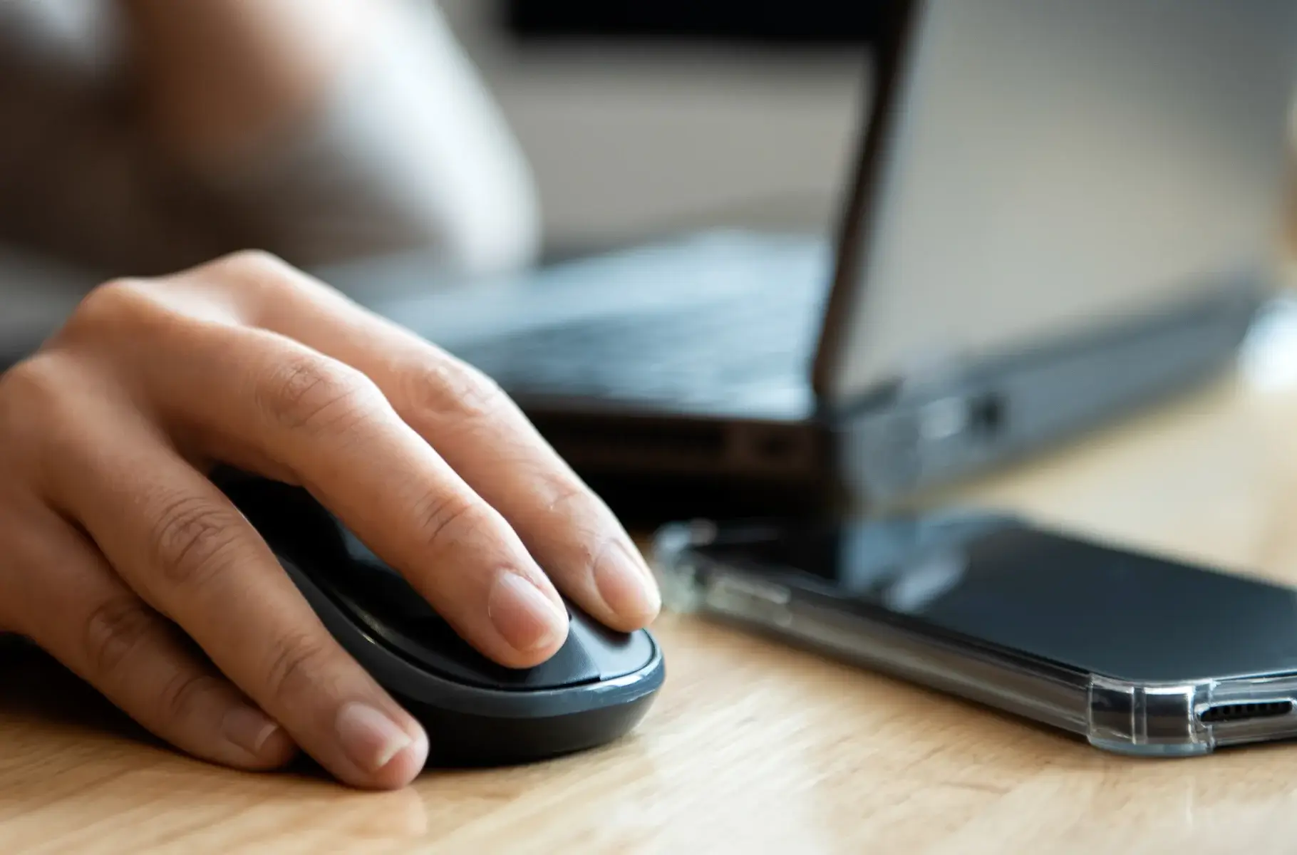 Office girl using mouse and laptop