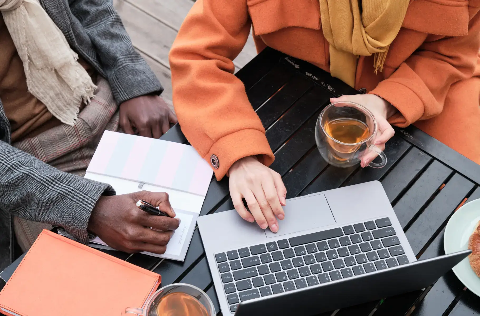 woman discussing her strategies and the guy jotting down notes